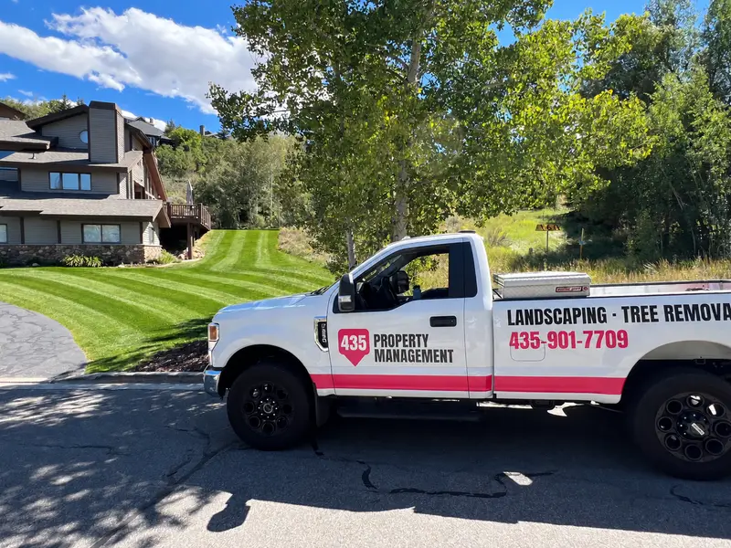 435 Property Management truck in front of a freshly striped lawn in Park City